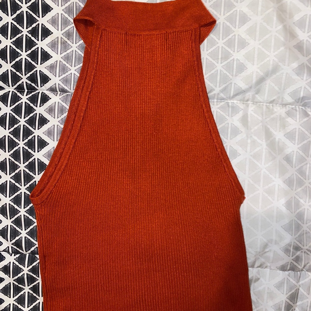 Orange front zip crop top.